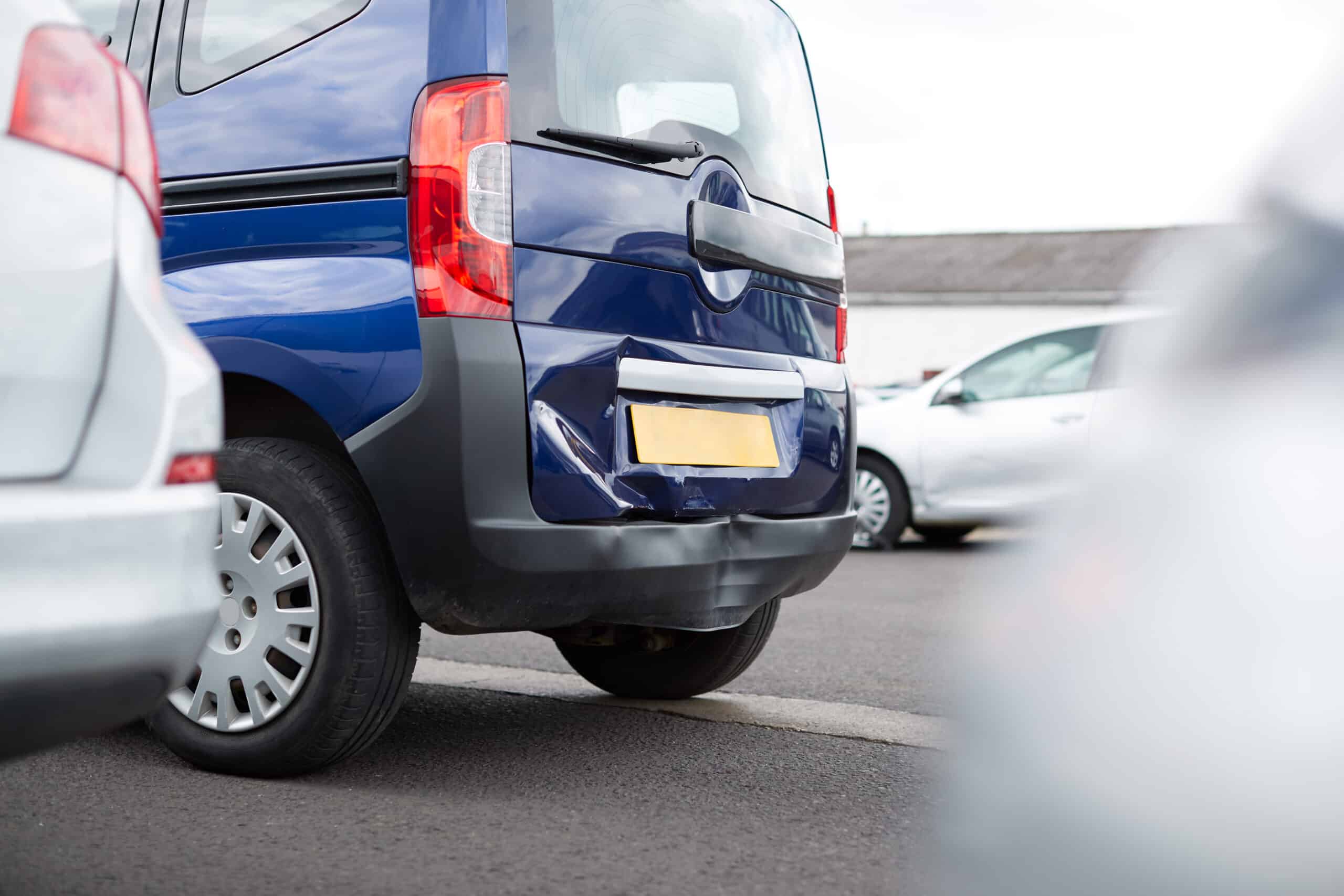Detail Of Damage To Rear Bumper Of Vehicle In Car Park